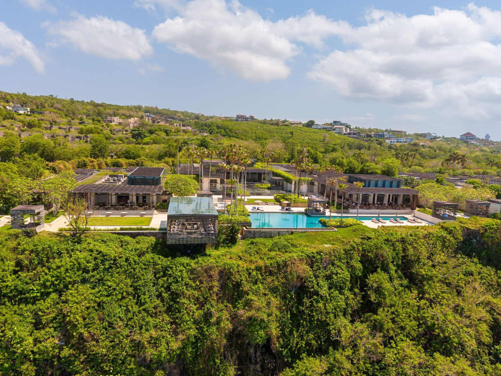 Aerial view of a luxury clifftop resort and villa in Bali