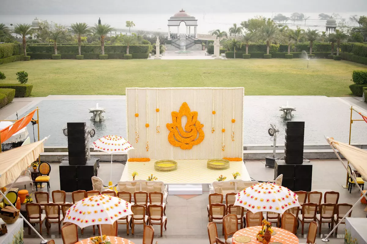 Marigold Ganesha floral installation and lakeside mandap stage by DreamzKrraft, the scale of work covered by the Los Angeles Times