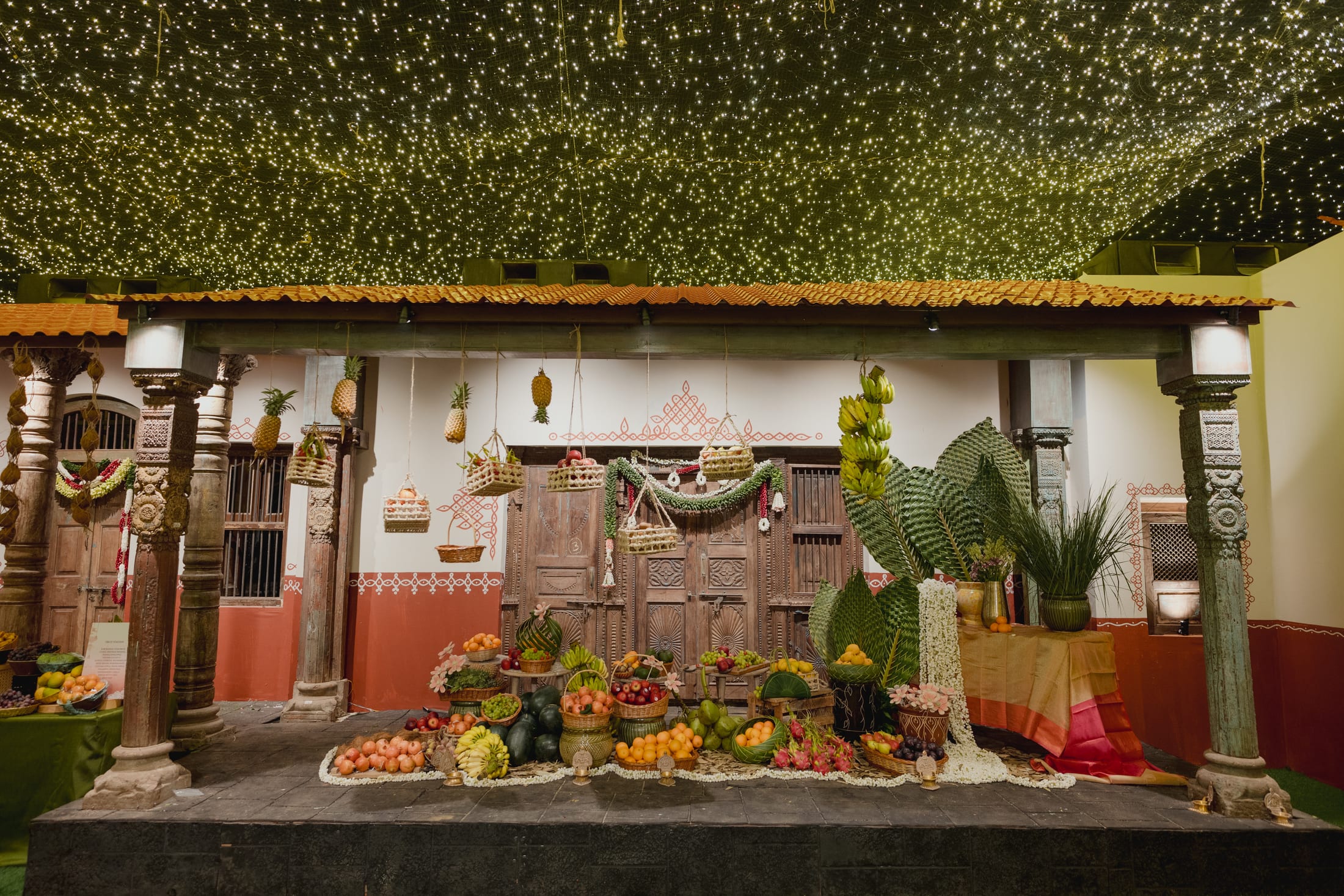 Themed mehendi and sangeet décor with florals and drapery by DreamzKrraft