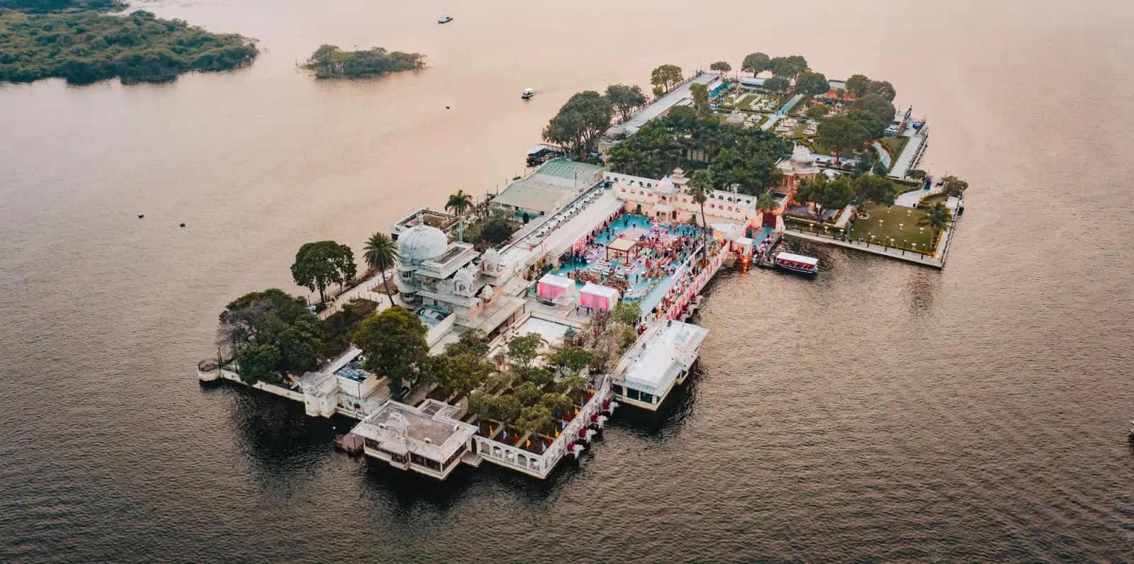 Aerial view of an Udaipur lake palace destination wedding celebration by DreamzKrraft